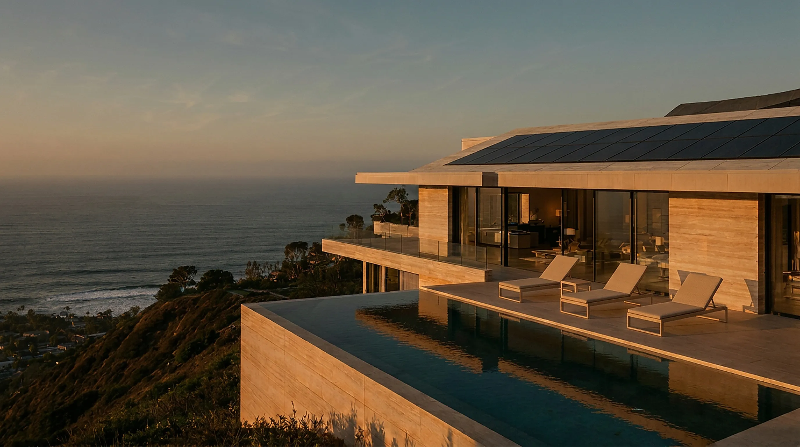 Modern Southern California estate with integrated solar panels at golden hour