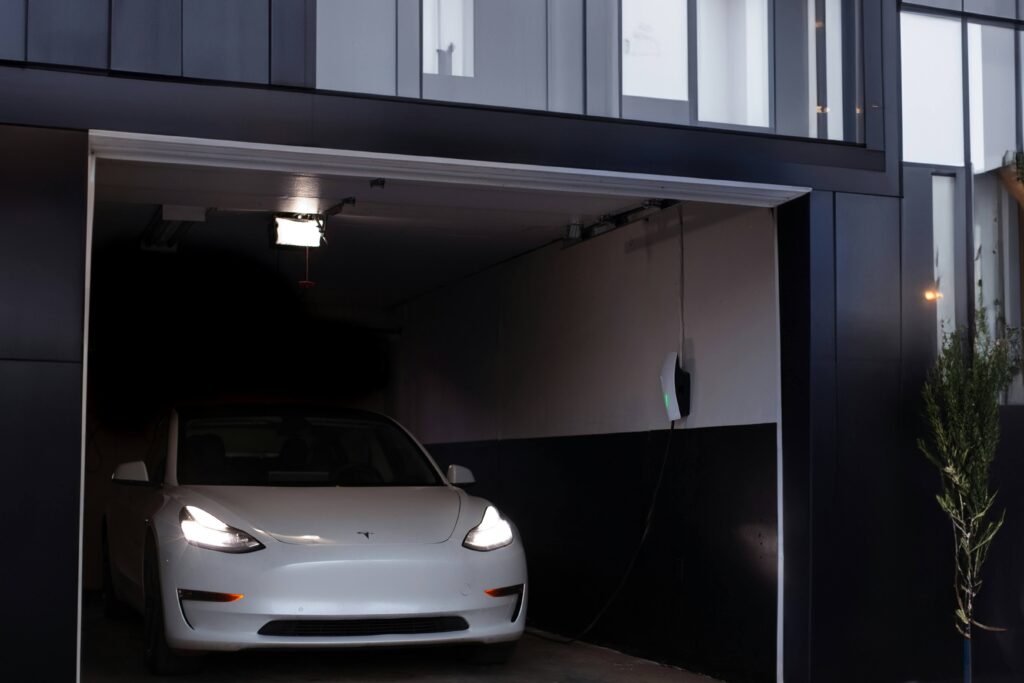 Tesla in garage with an EV car charger