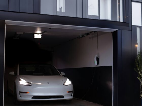 Tesla in garage with an EV car charger